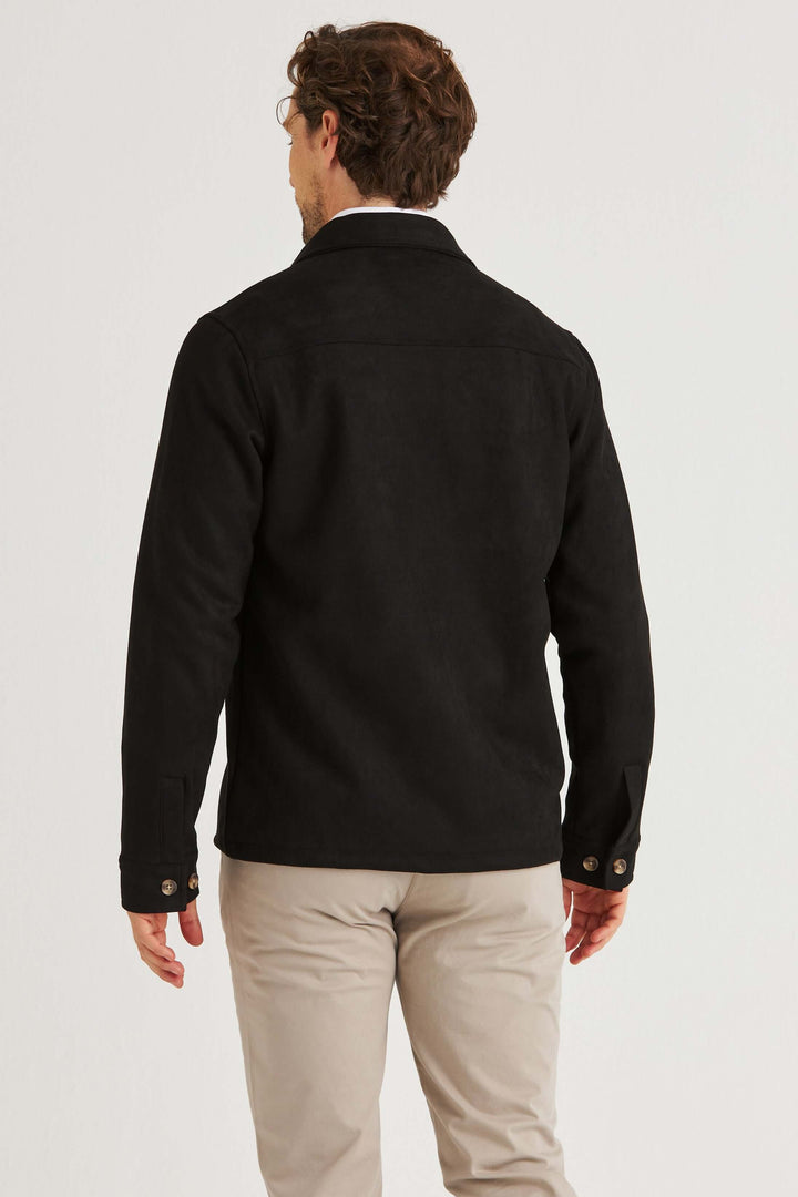 Man wearing a svart suede overshirt, viewed from the back, showcasing the soft texture and stylish design.